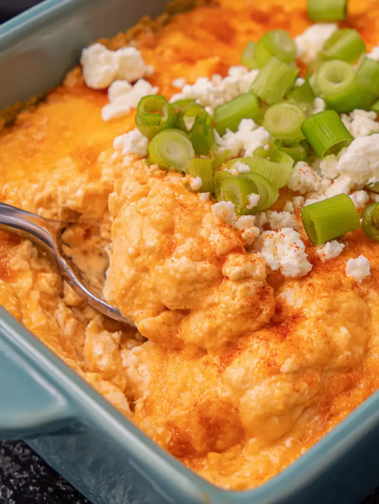 Creamy Frank's RedHot buffalo chicken dip served with tortilla chips and vegetables.