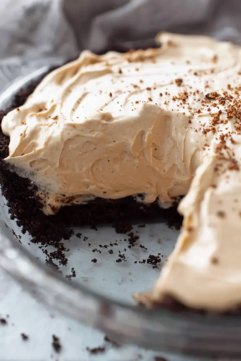 Close-up of creamy coffee pie with Oreo crust and coffee beans on top