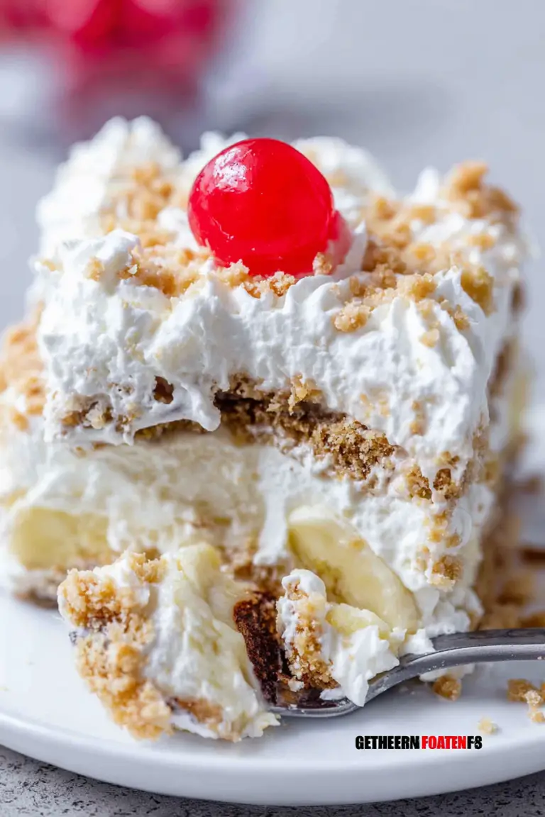 Delicious no-bake banana split cake garnished with nuts and cherries