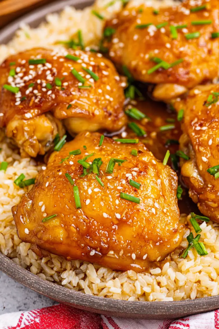 Delicious slow cooker brown sugar garlic chicken served with green onions and sesame seeds