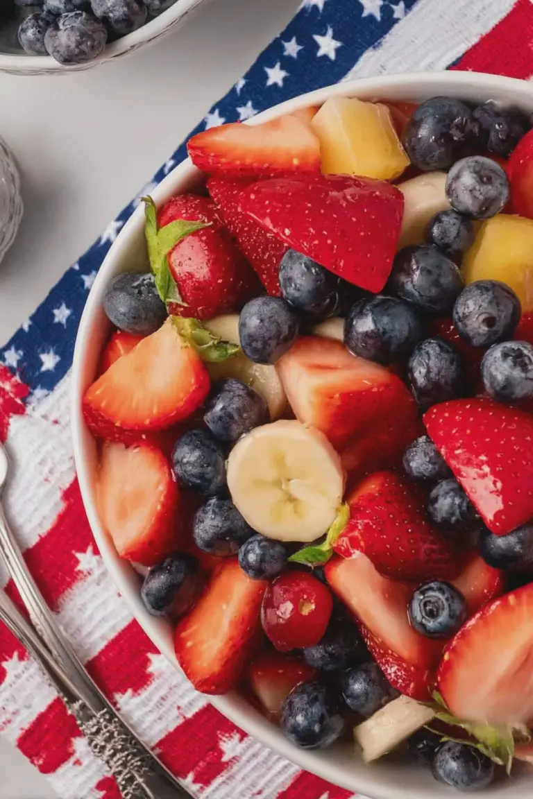 Colorful 4th of July fruit salad with strawberries, blueberries, and bananas, perfect for a festive summer celebration.